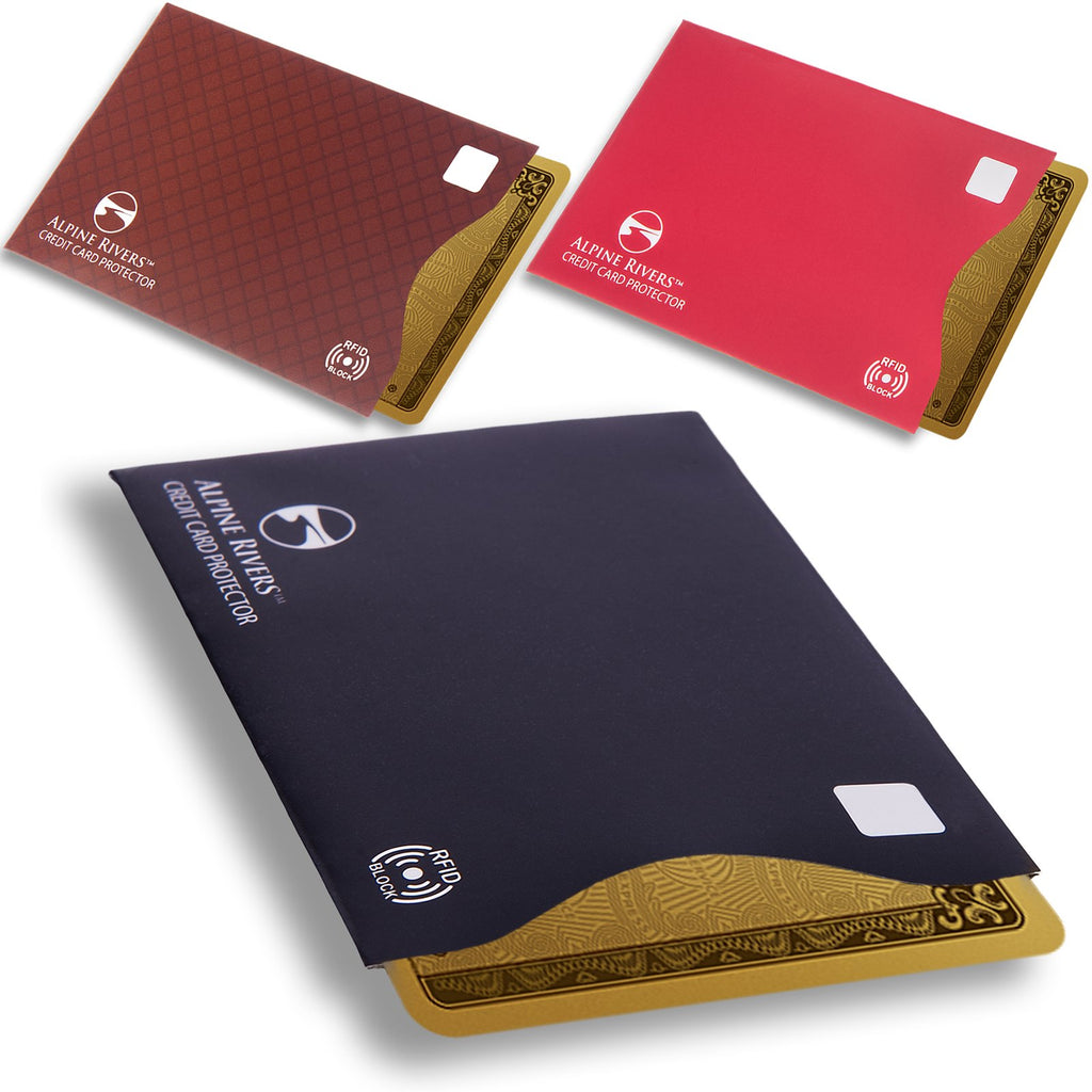 Alpine Rivers multi-colour RFID blocking credit card protectors in red, brown and black, each with a card part-inserted.