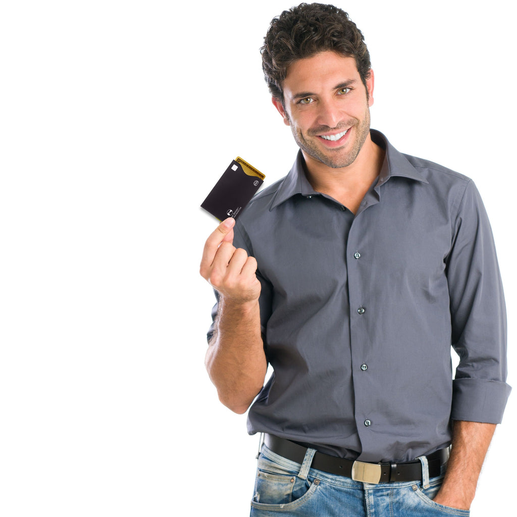 Black Alpine Rivers RFID blocking card sleeve, top-load, held by a traveler